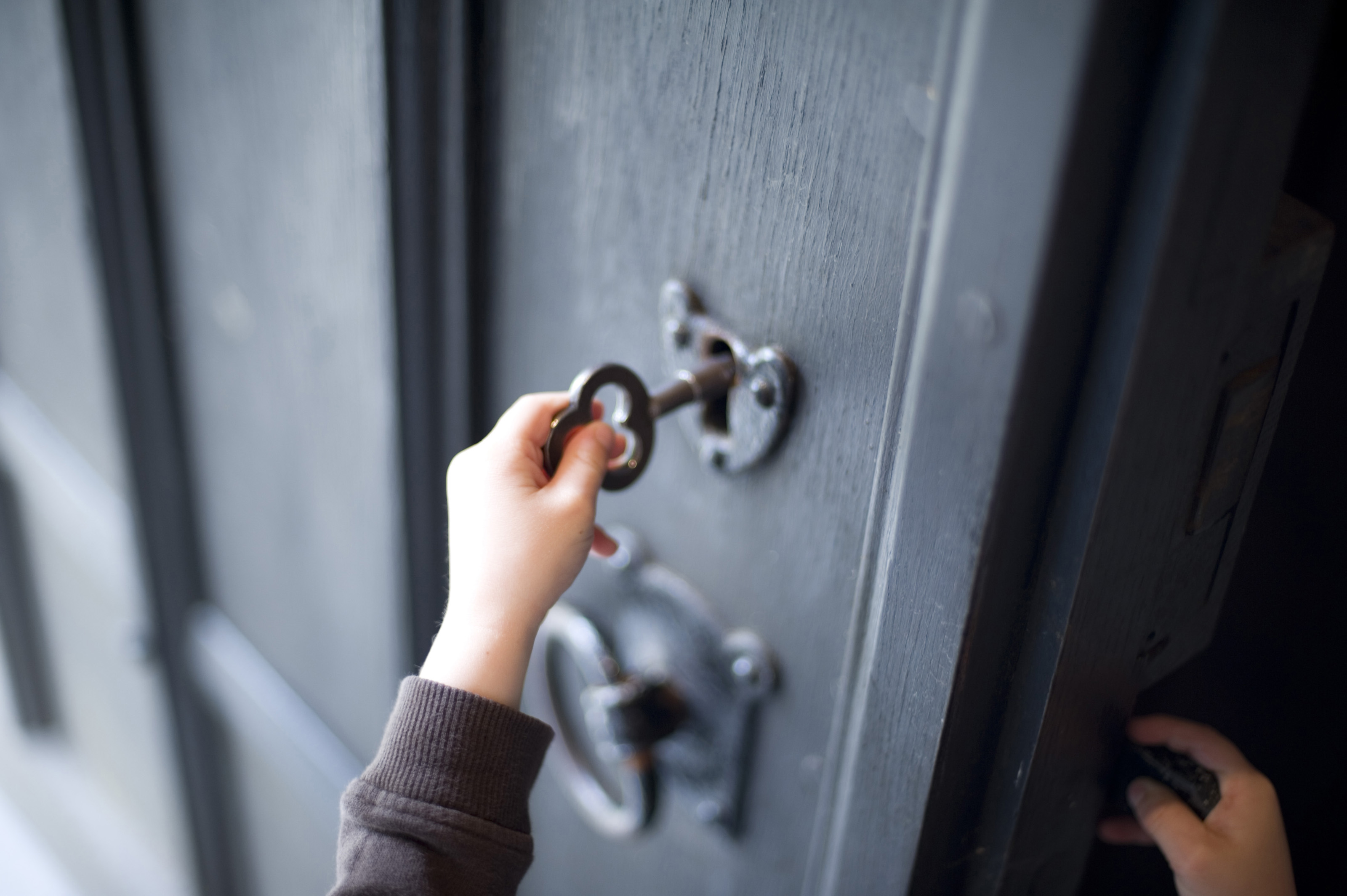 Child unlocking a door-6823 | Stockarch Free Stock Photos How To Unlock A Door With Key