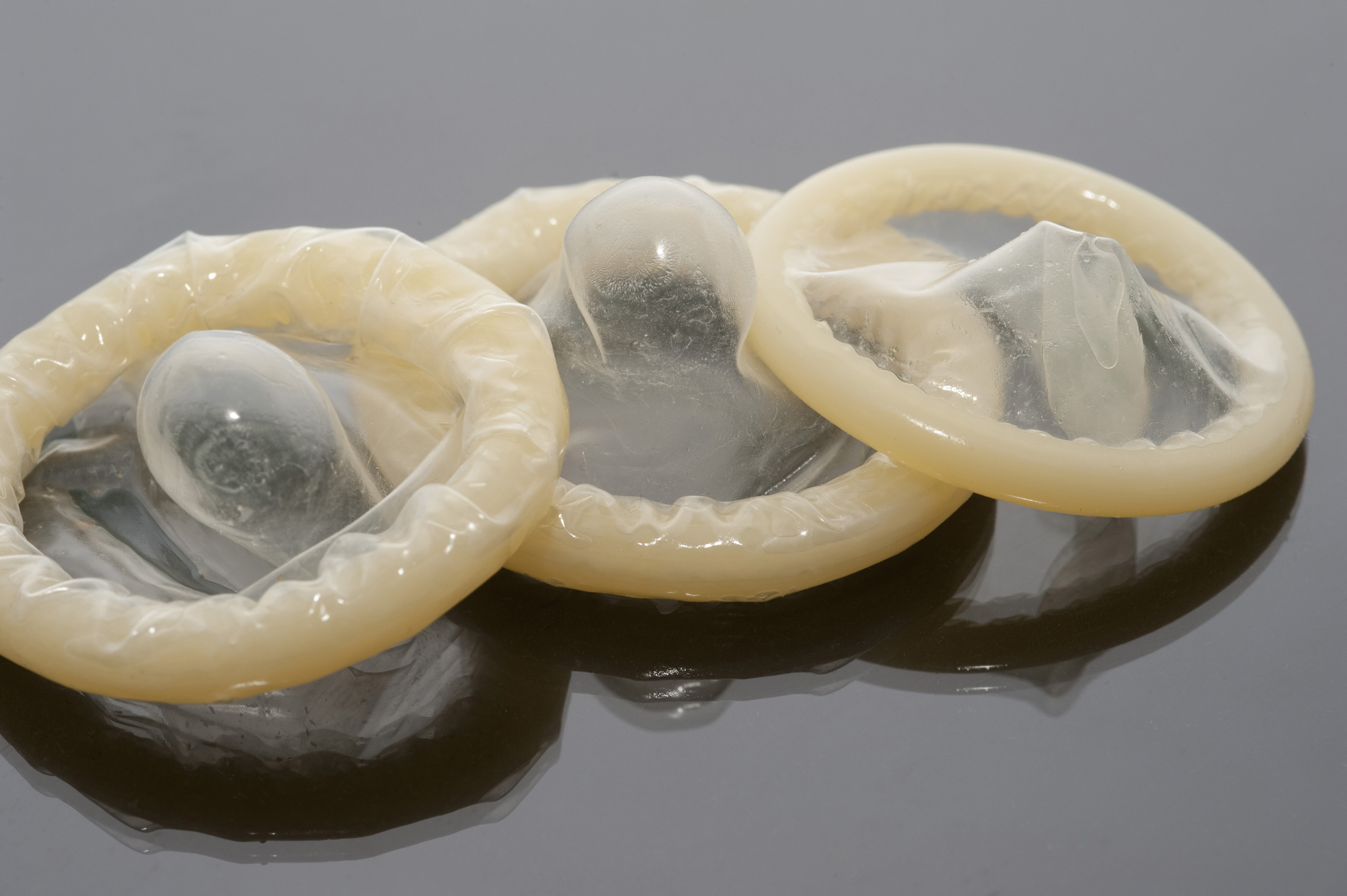 download stock photo Three unused male condoms to be used during sexual int...