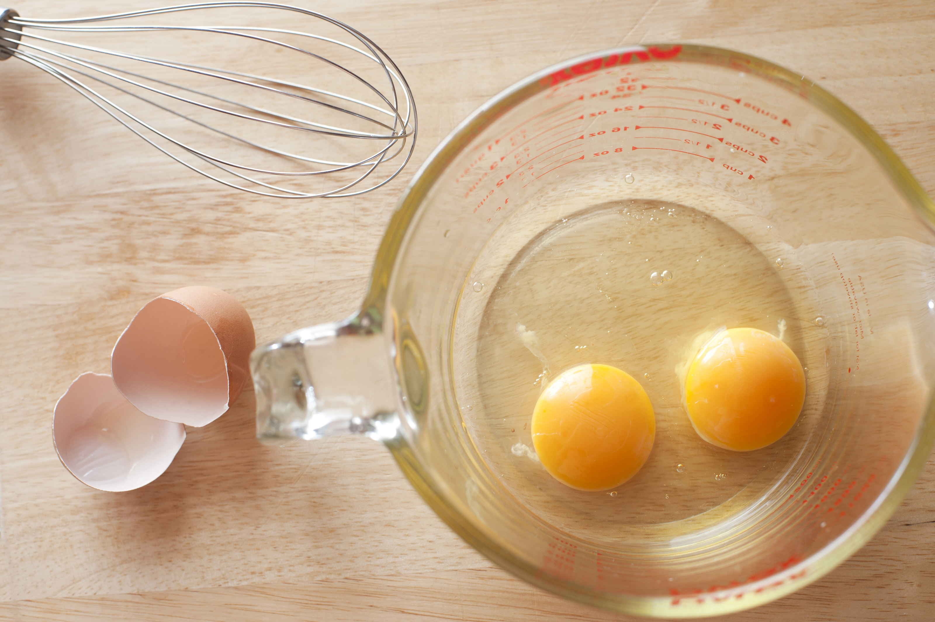 Mixing eggs and flour in bowl hi-res stock photography and images