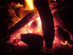 stock image a log fire with red hot burning wood