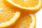 stock image Sliced oranges texture showing the juicy pulp, rind, pith and segments, close up view