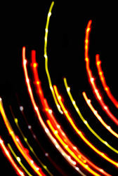 concentric curved red and green coloured lines of light with bright highlights