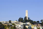 The coit tower memorial on top of one san franciscos hills, pictured on a sunnyday