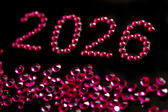 new year 2026 written out in red sparkling jewels