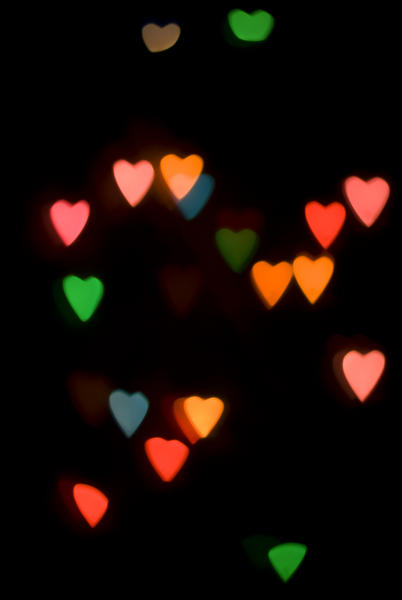colourful bokeh light shape created using a cutout loveheart mask
