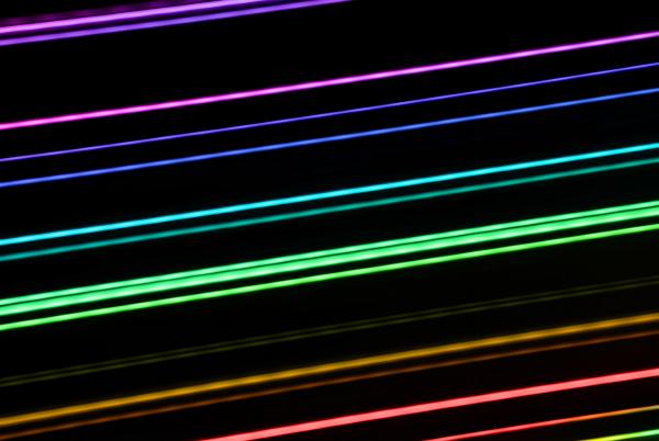 colourful lines of light, long exposure painting with light image composed of rainbow colours