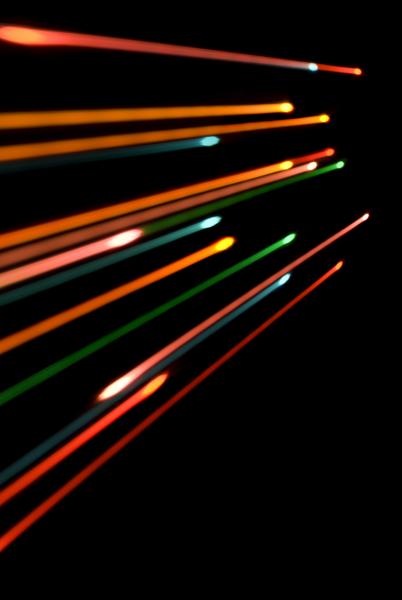 colourful lines of lite dissappearing towards a vanishing point