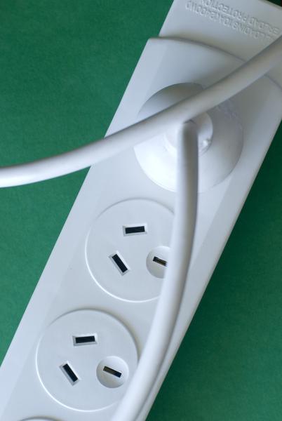 A power cable plugged into a mains voltage power outlet, Australian NZ three pin connection