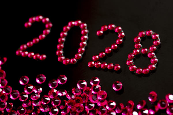 the year 2028 written out in red glittering jewels