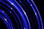 concentric curved blue coloured lines of light on a black background