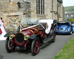a vintage car being used at a wedding service